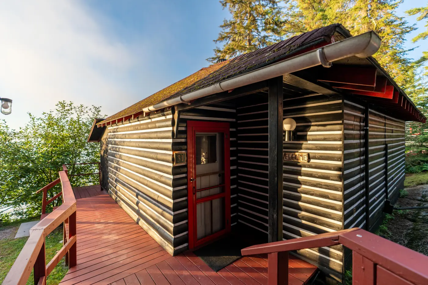 Cabin exterior featuring accessible ramps and walkways.