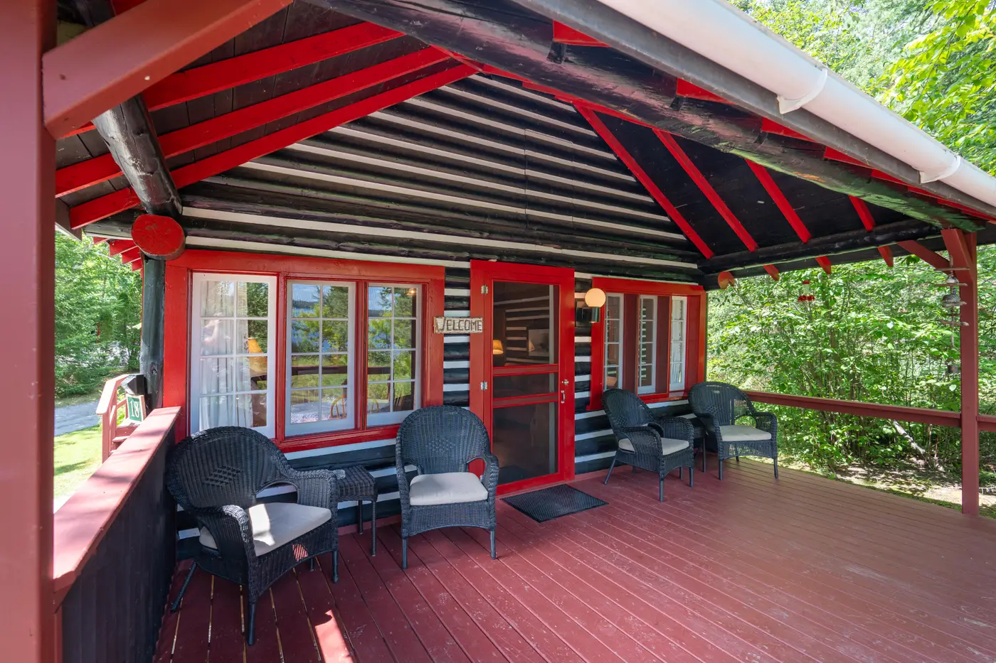 Lodge exterior with a walk-out dock facing the lake.