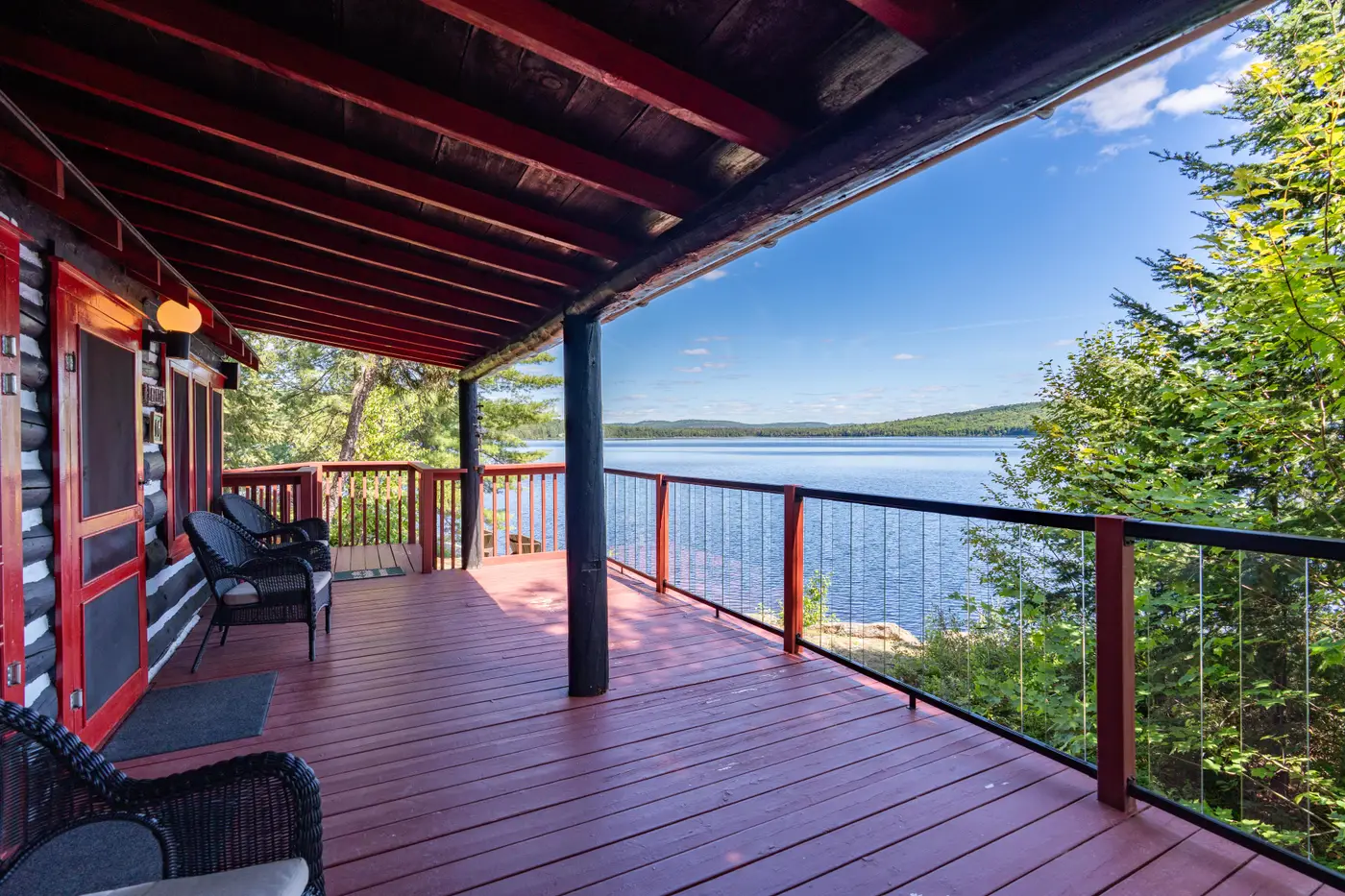 Cabin featuring a spacious deck at Killarney Lodge in Algonquin Park.