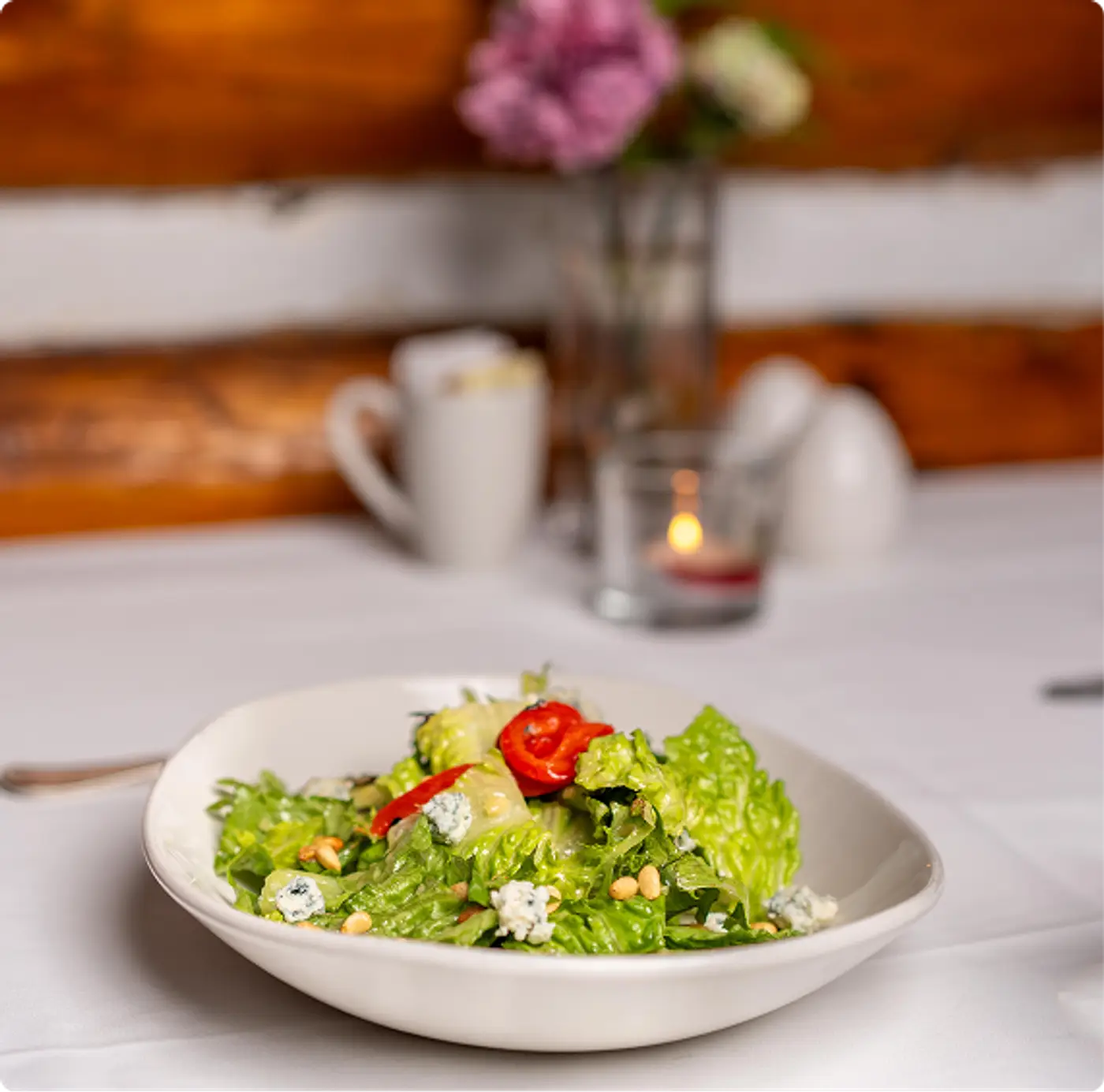 A fresh delicious salad plated and ready to enjoy at Killarney Lodge in Algonquin Park.