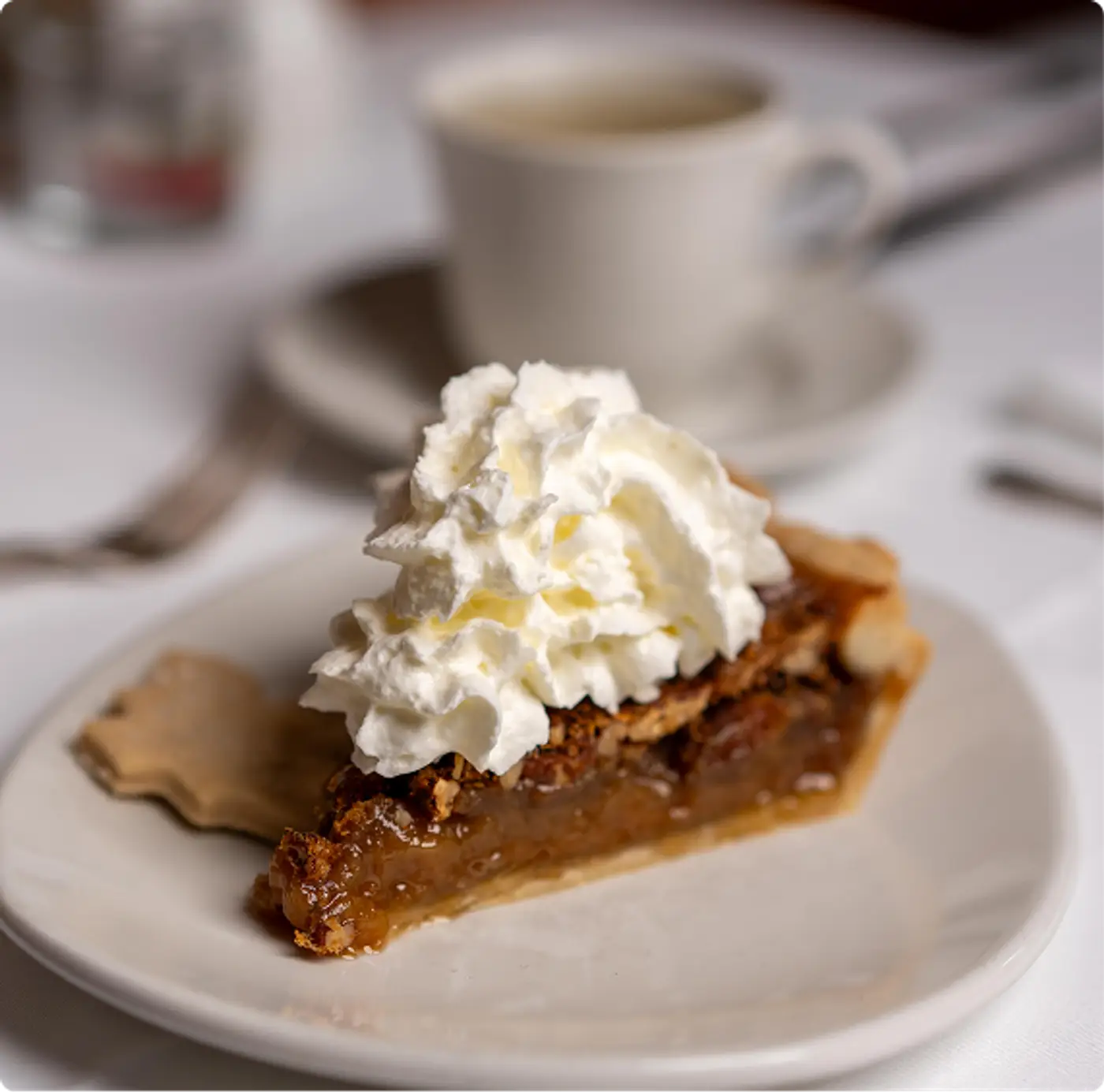 A delicious slice of pecan cake and whipped cream at Killarney Lodge in Algonquin Park.