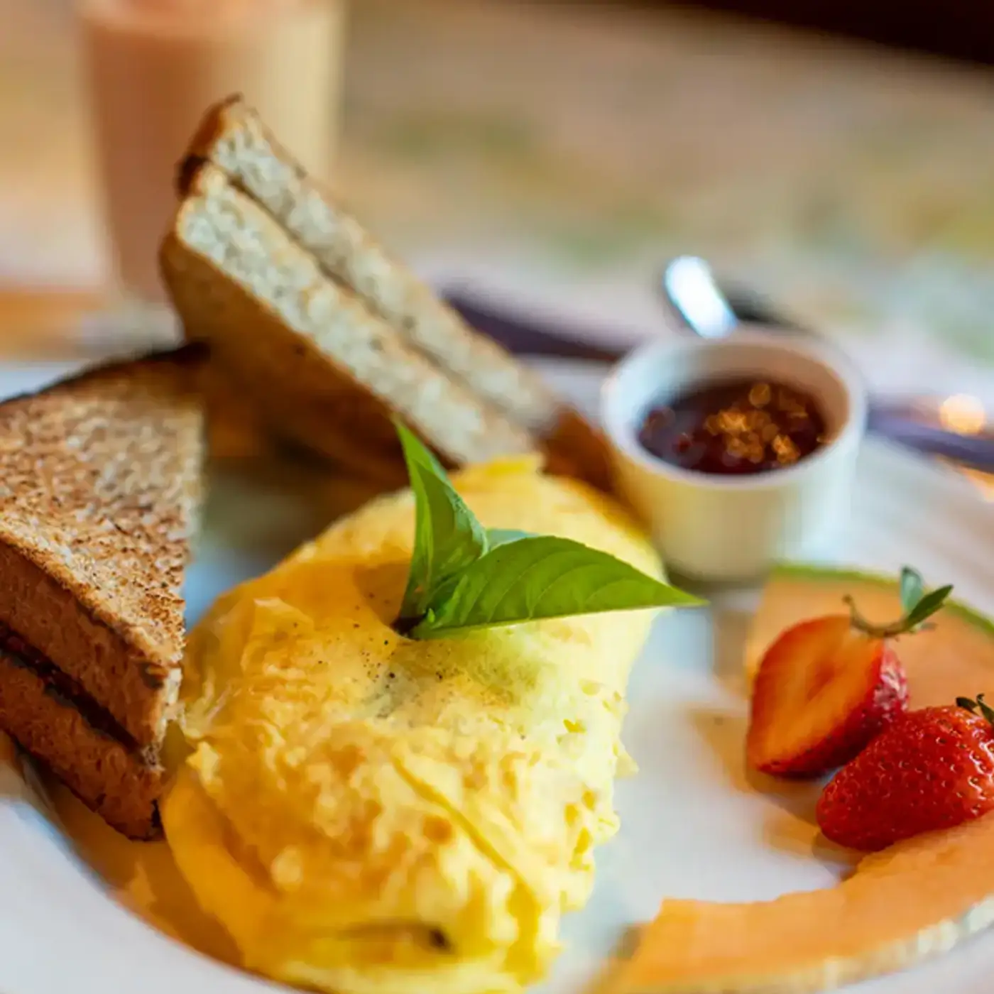 Omelet with freshly cut fruit, crispy toast and jam, cooked to perfection at Killarney Lodge in Algonquin Park.