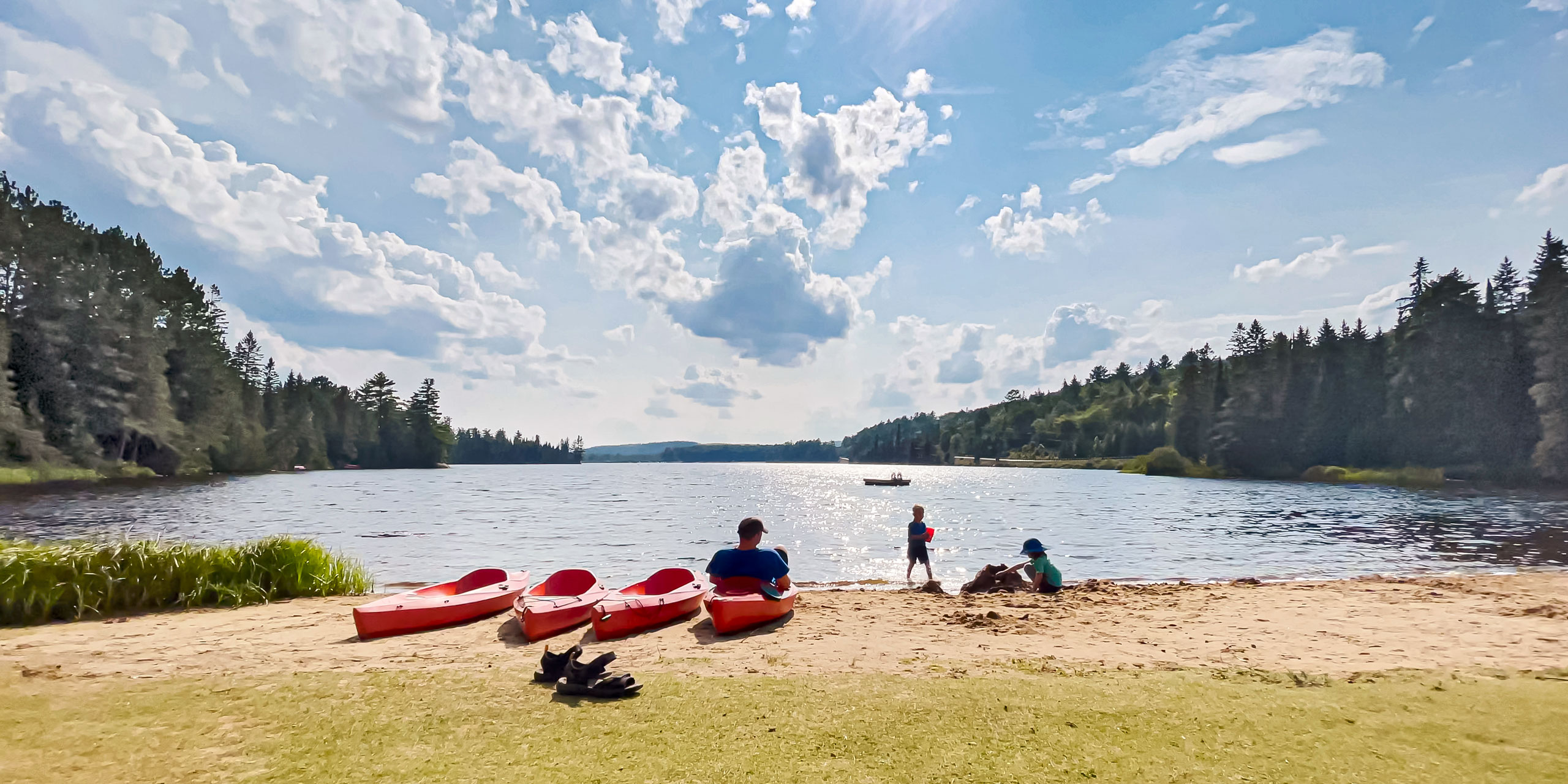 family time at the beach with children making sandcastles