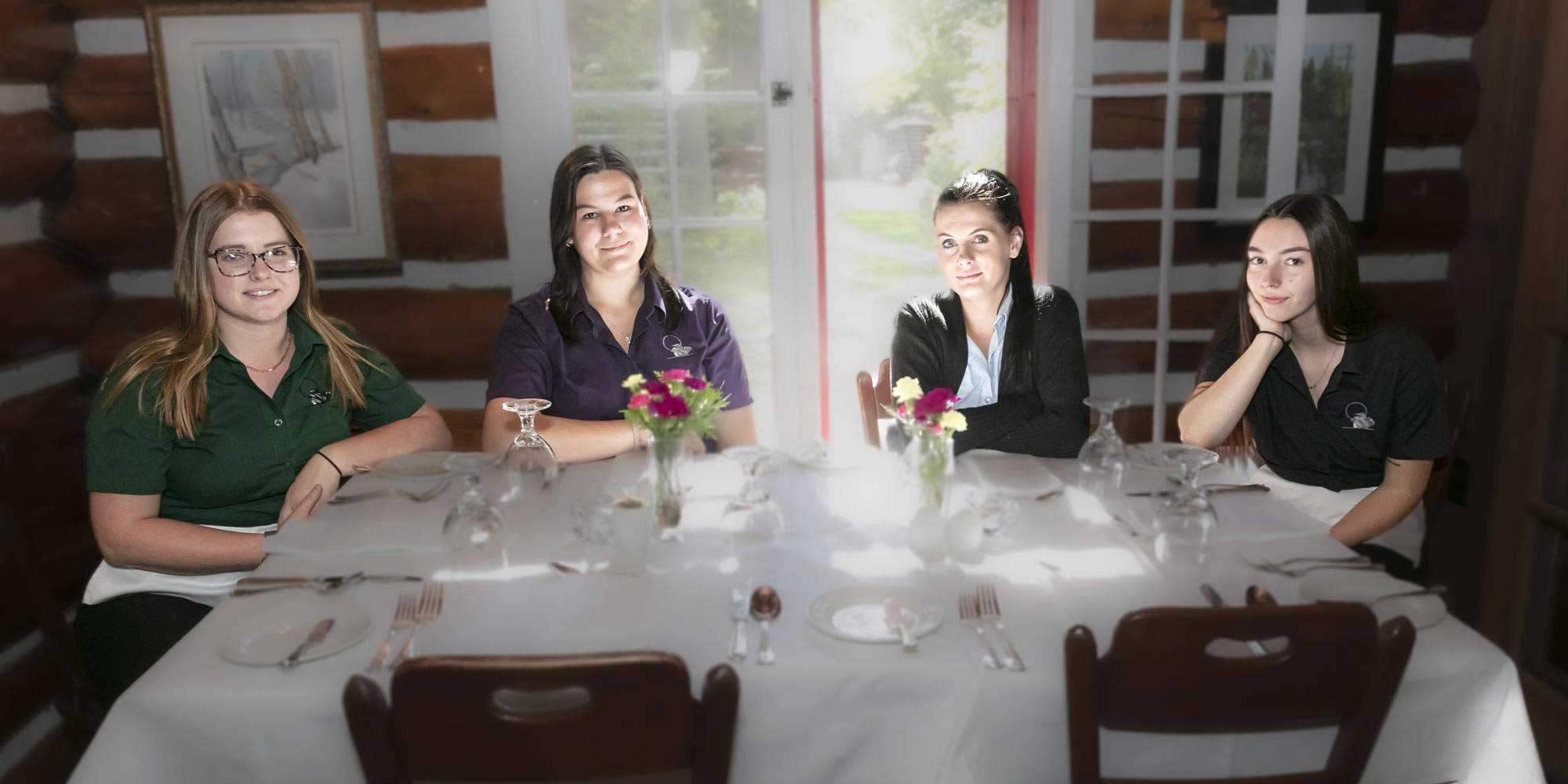 Wait staff in the log dining room at Killarney Lodge